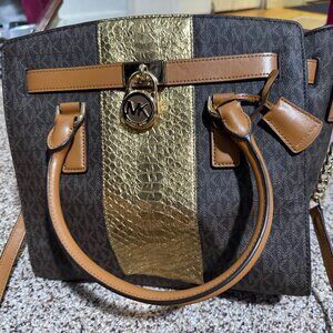 Michael Kors handbag, specifically from the Michael Kors Hamilton Satchel line.